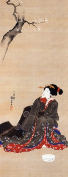 Mujer sentada bajo un cerezo en flor